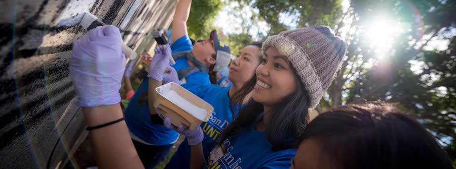 2 of 4, Students paint wall for MLK Day